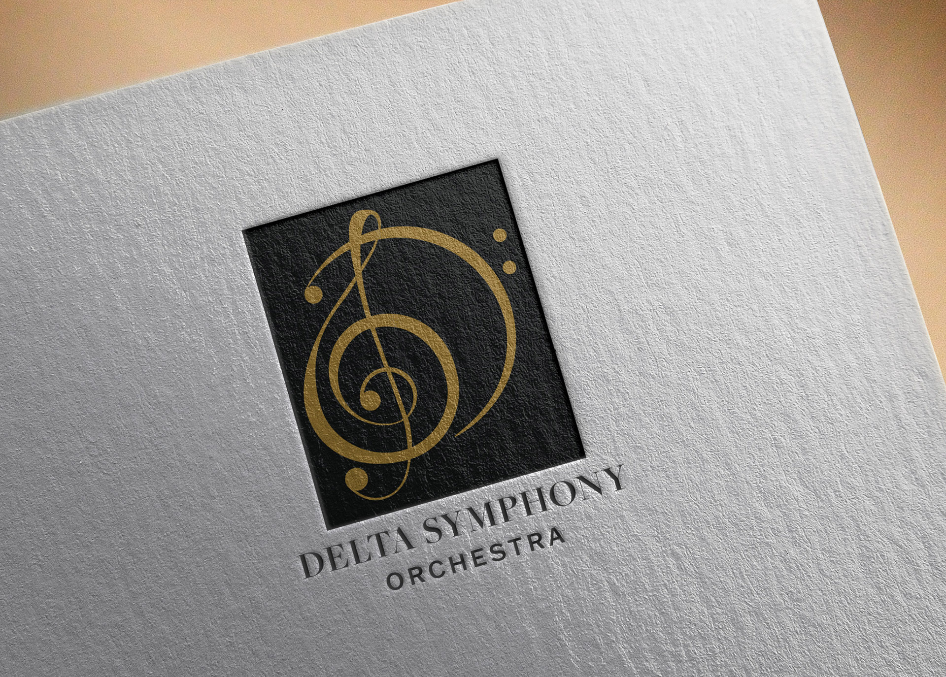 mockup of delta symphony orchestra logo on textured paper